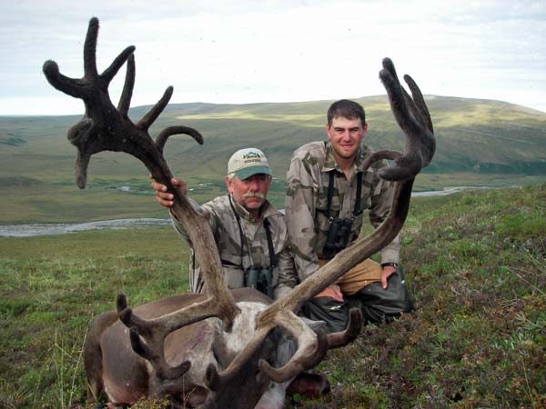 Alaska Caribou hunting clients with large Caribou.