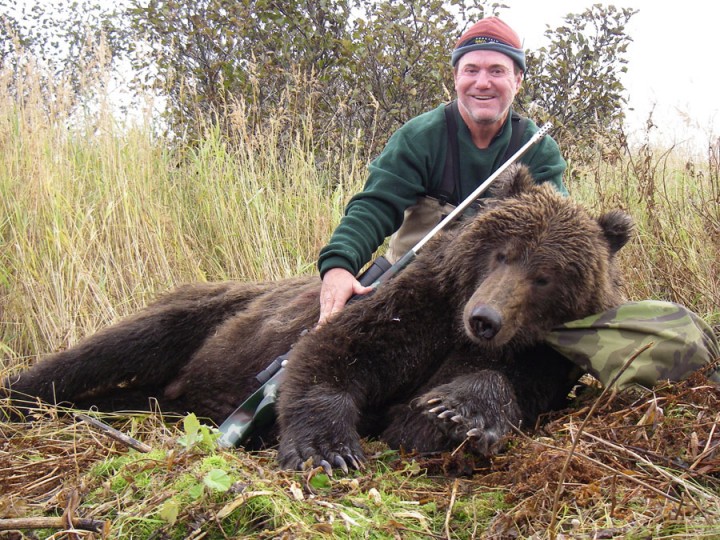 Hunter with his large bear taken during Arctic North Guides hunt.