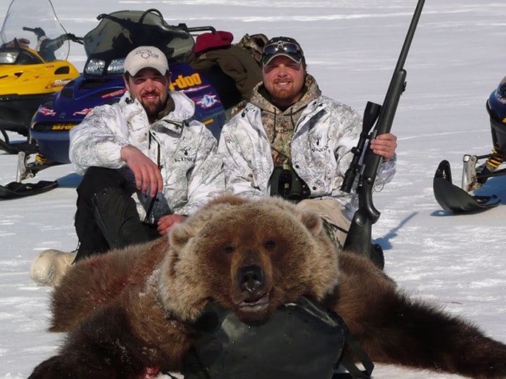 Two hunters with Spring bear hunting Arctic North Guides.